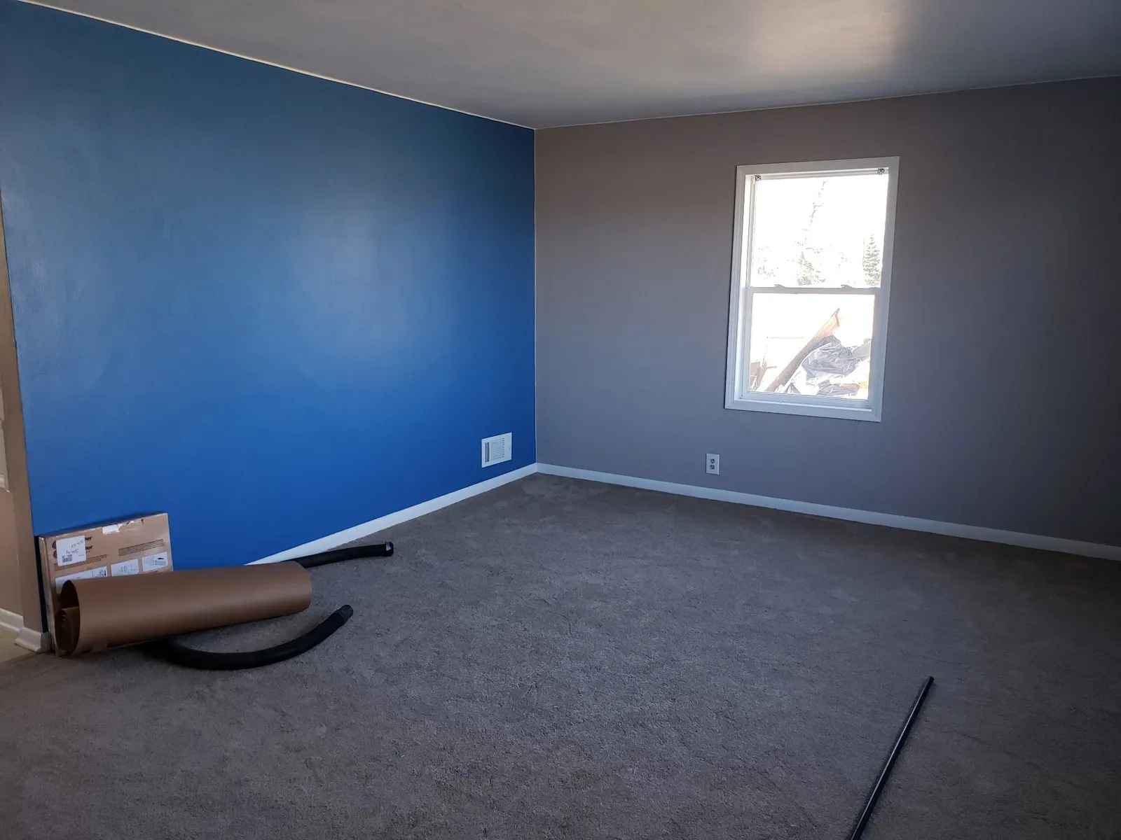 Blue accent wall and crisp white trim