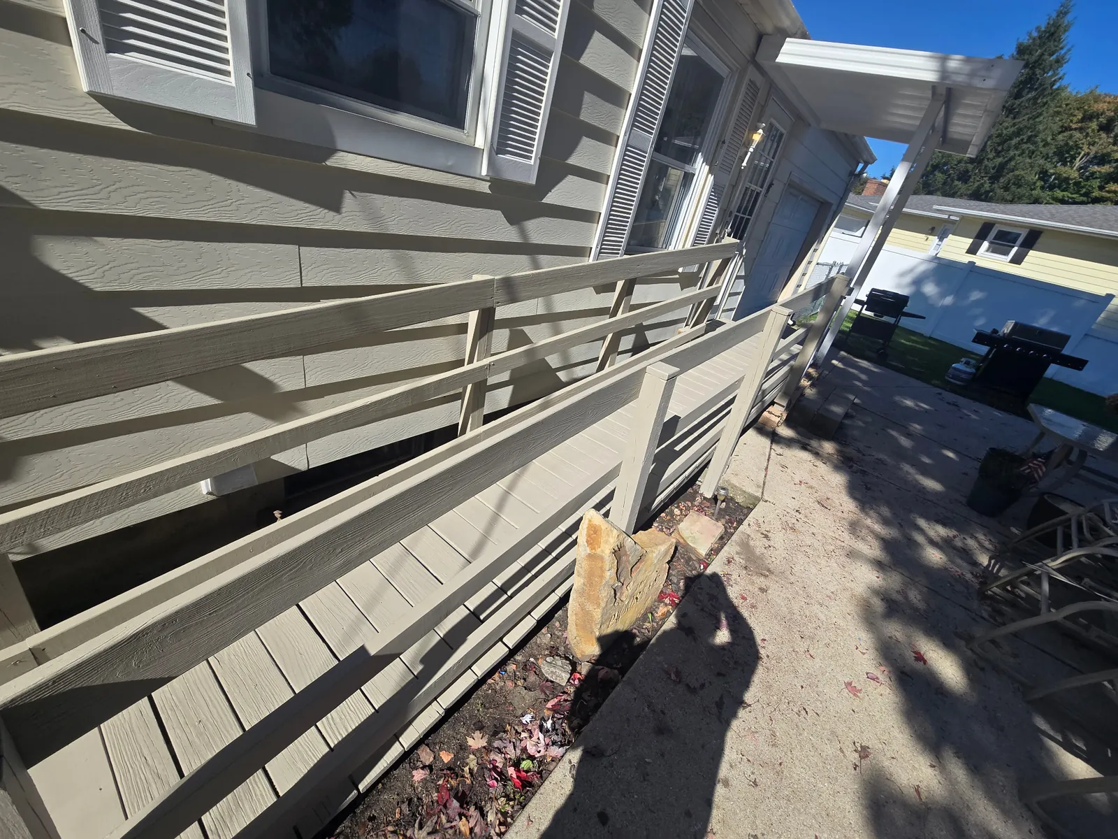 Full length of Rebecca project access ramp after pressure washing, repairs, and painting